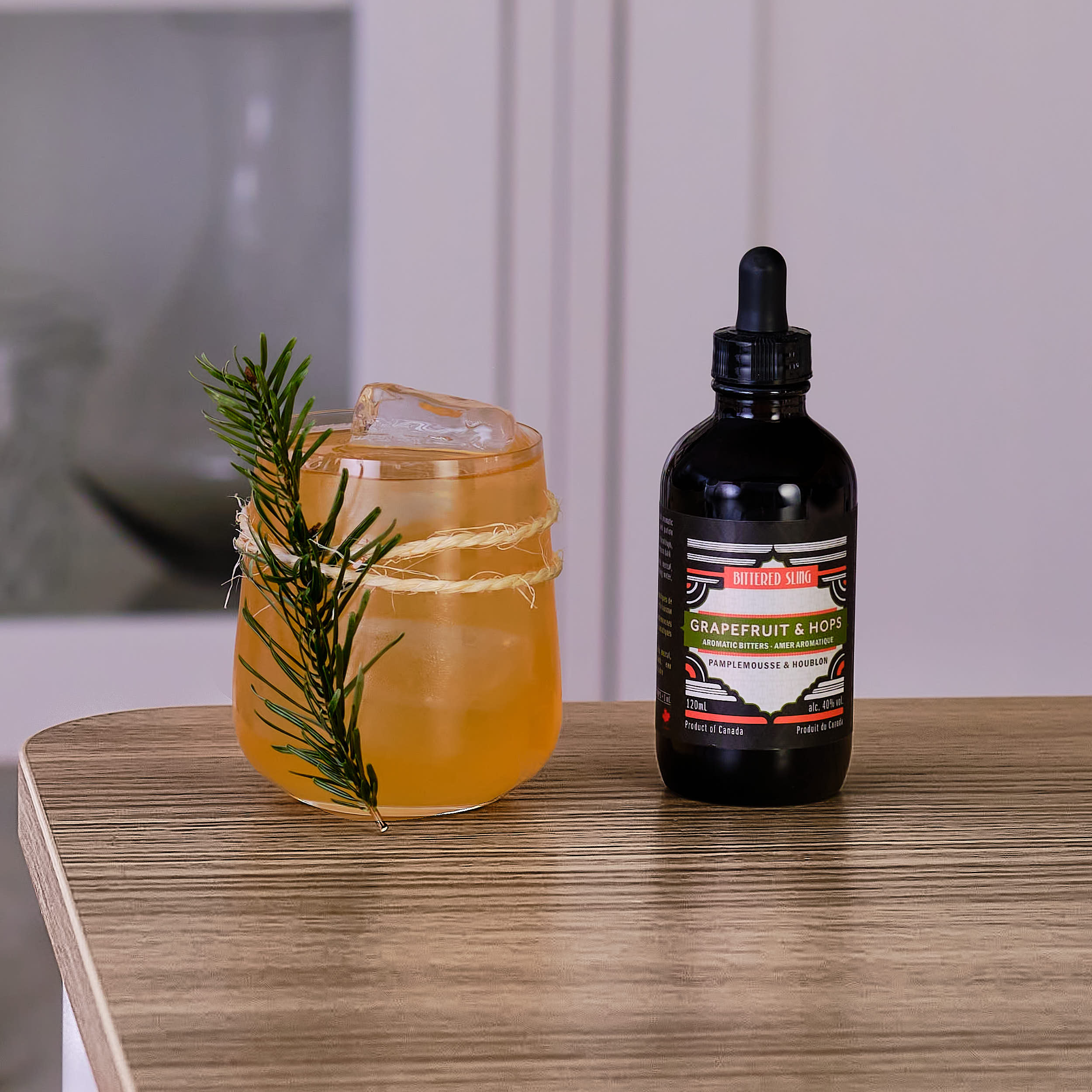 Drink with Grapefruit and Hops bitters beside it